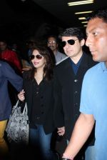 Madhuri dixit snapped with husband in Mumbai Airport on 6th April 2012 (30).jpg
